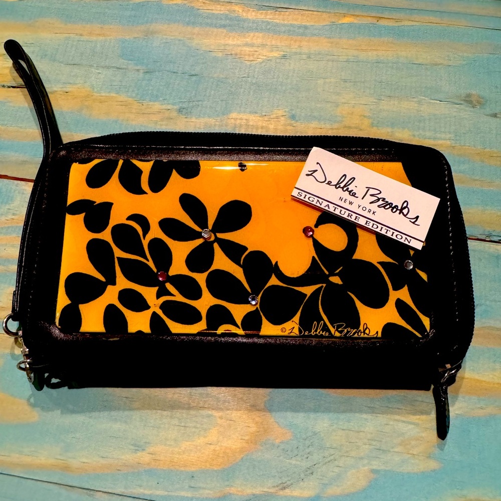 Debbie Brooks enamel yellow and black floral wallet.